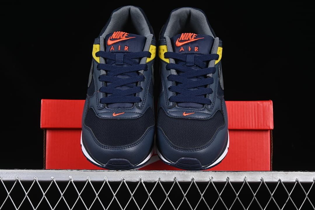 Front view of the pair showing navy mesh uppers and coral tongue logos.