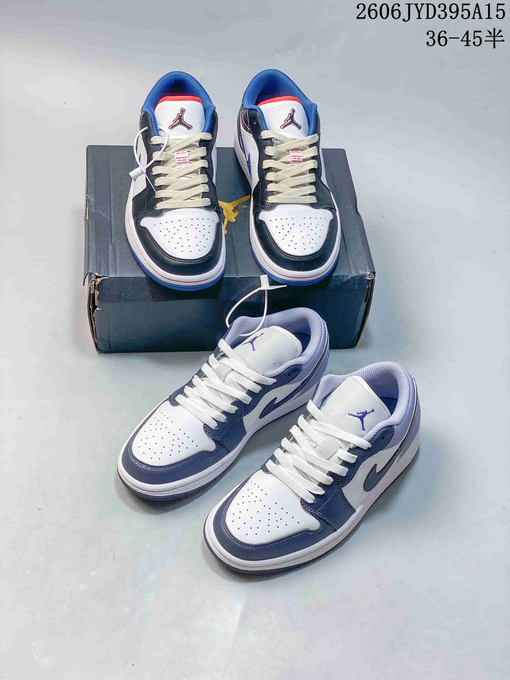 Two pairs of white Jordan low-top sneakers with blue and gray accents