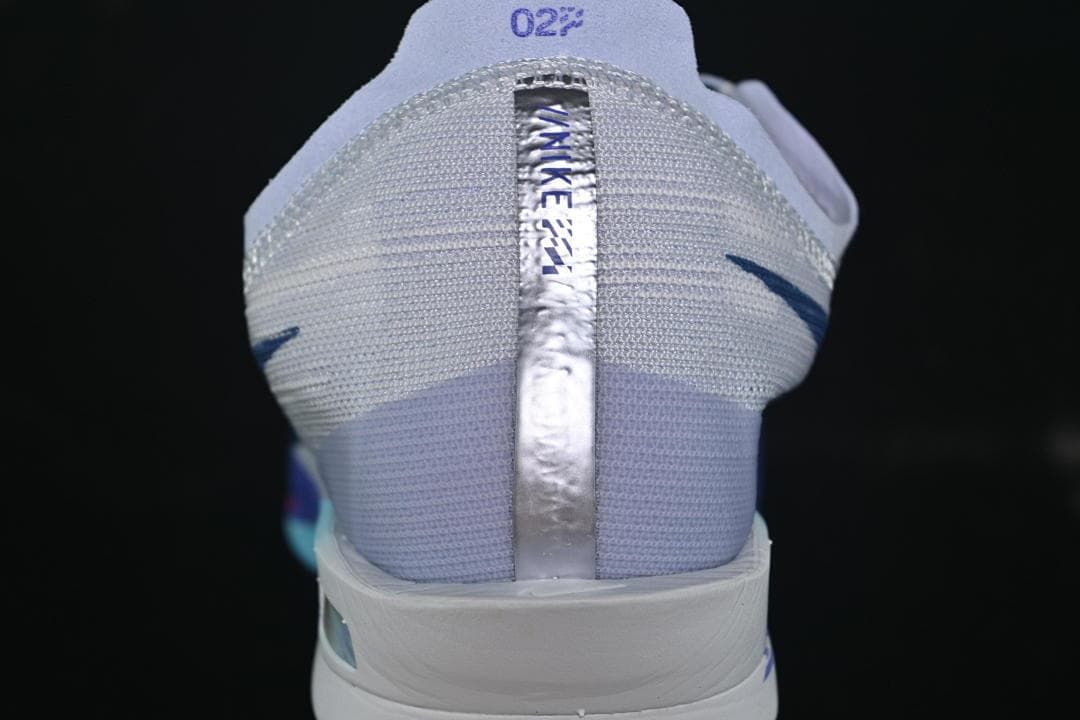 Rear view showing the heel design and reflective-looking center strip.