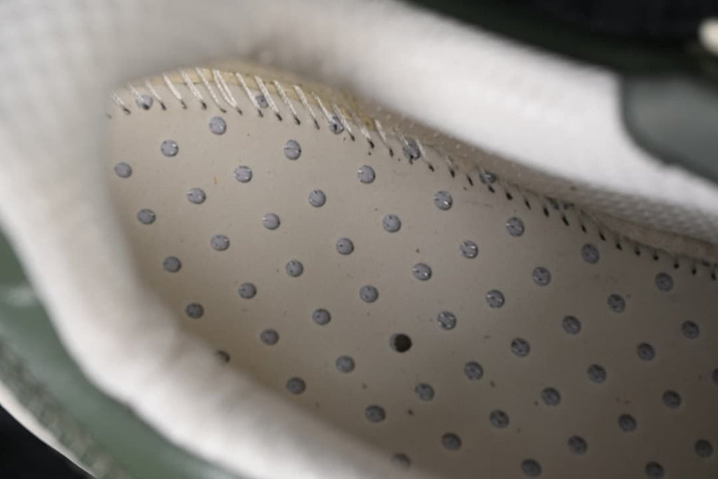 Close-up view inside the sneaker showing a perforated inner surface