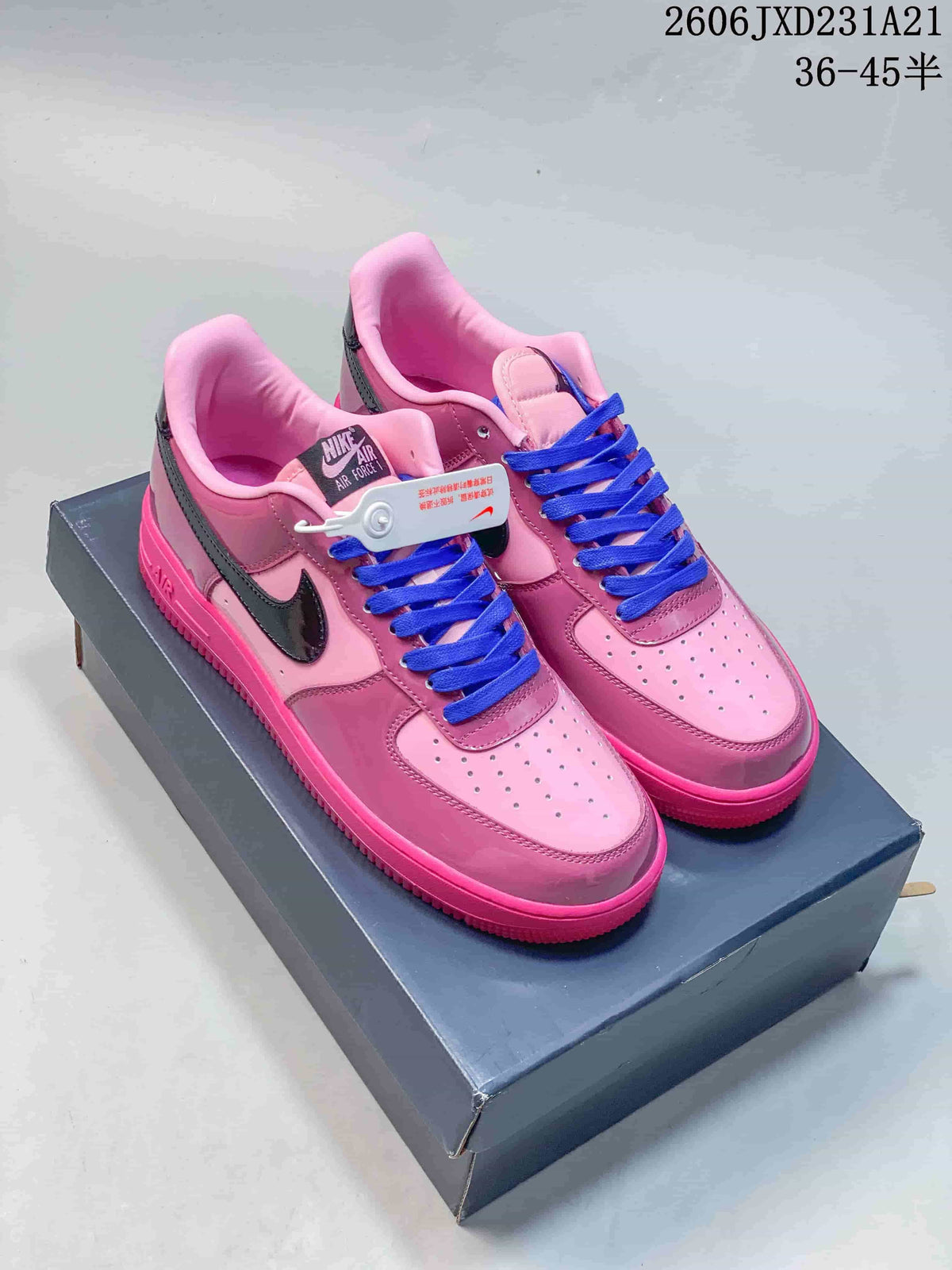 Pink Nike Air Force 1 ’07 LV8 low-top sneakers with blue laces on a shoe box
