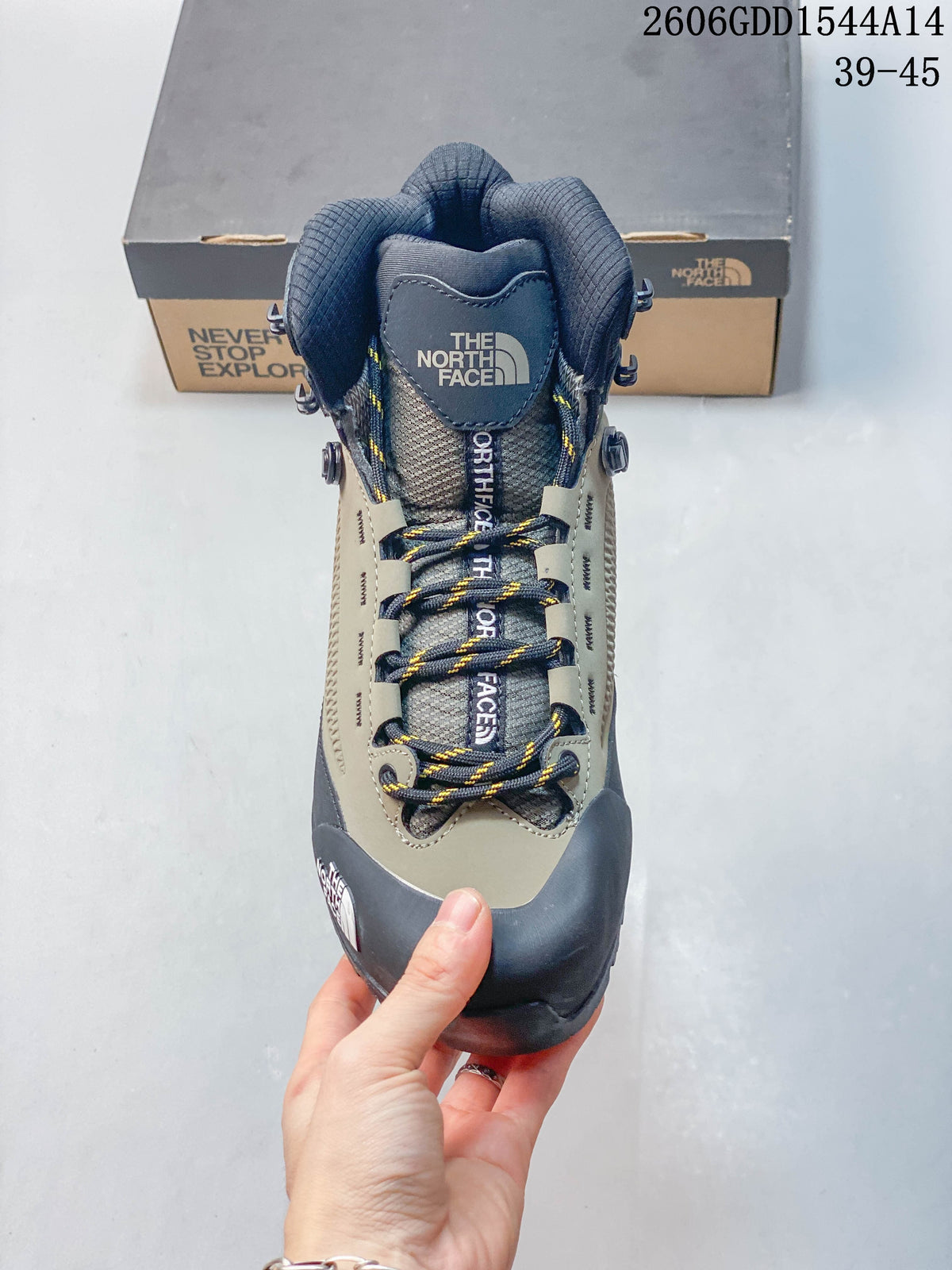 Top view of the boot showing its padded tongue, patterned laces, and lace hooks.