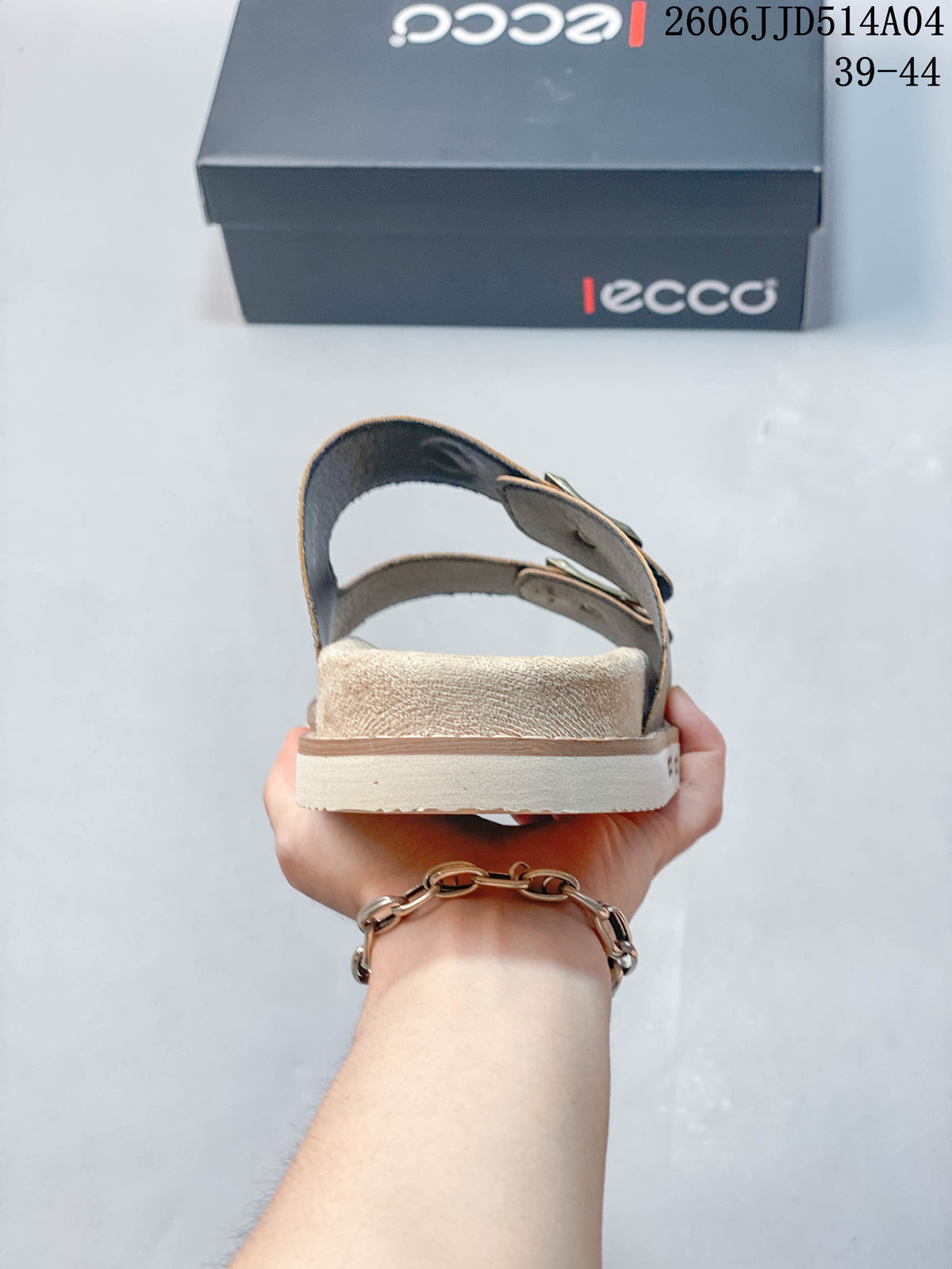 Rear view of a taupe slide sandal showing the heel and layered sole; image overlay shows 06JJD514A04 and sizes 39–44.