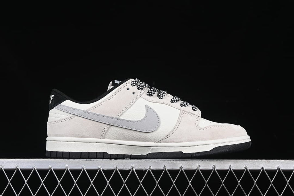 Side profile showing the grey Swoosh and off-white upper