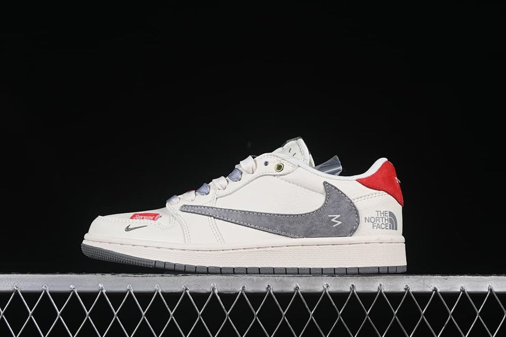Side view of an off-white low-top sneaker with gray Swoosh, red heel panel, and The North Face wording.