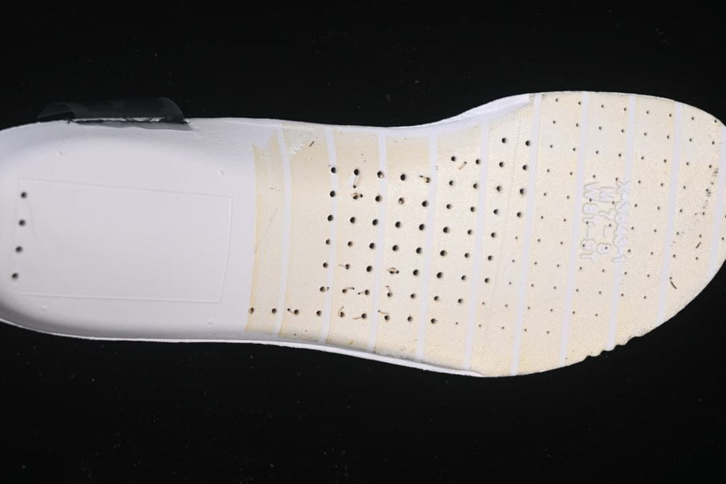 Underside view showing the white forefoot outsole of the running shoe