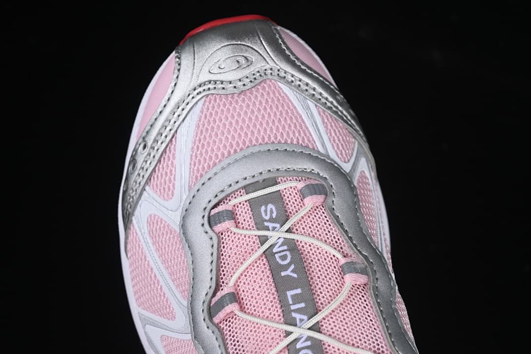 Top-down detail of the sneaker toe, laces and layered overlays