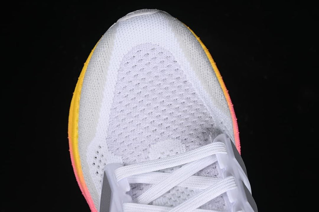 Top view of the white knit-style toe and lacing