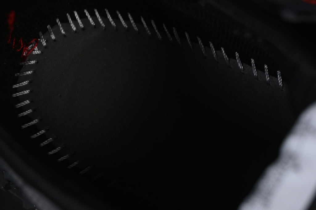Close-up of the dark insole and contrasting perimeter stitching