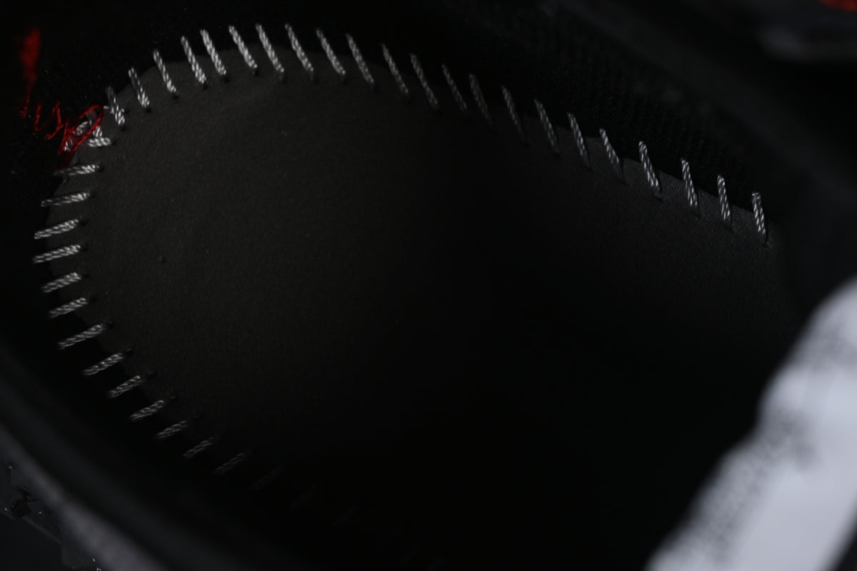 Close-up of the dark insole and contrasting perimeter stitching