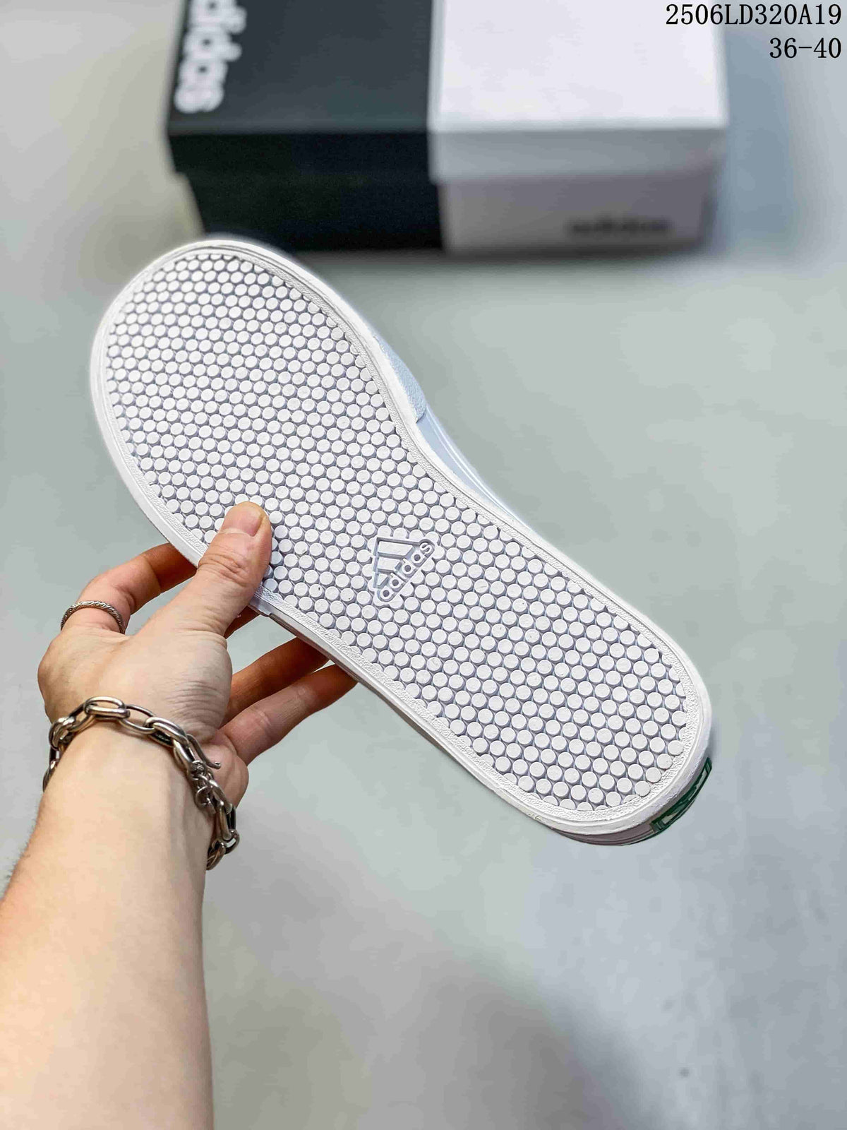 Underside of the white sneaker sole with a circular tread pattern