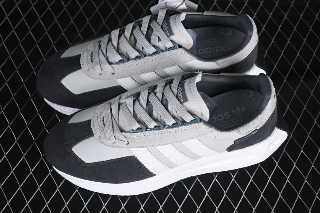 Pair of gray, white, and charcoal Retropy E5 sneakers viewed from above