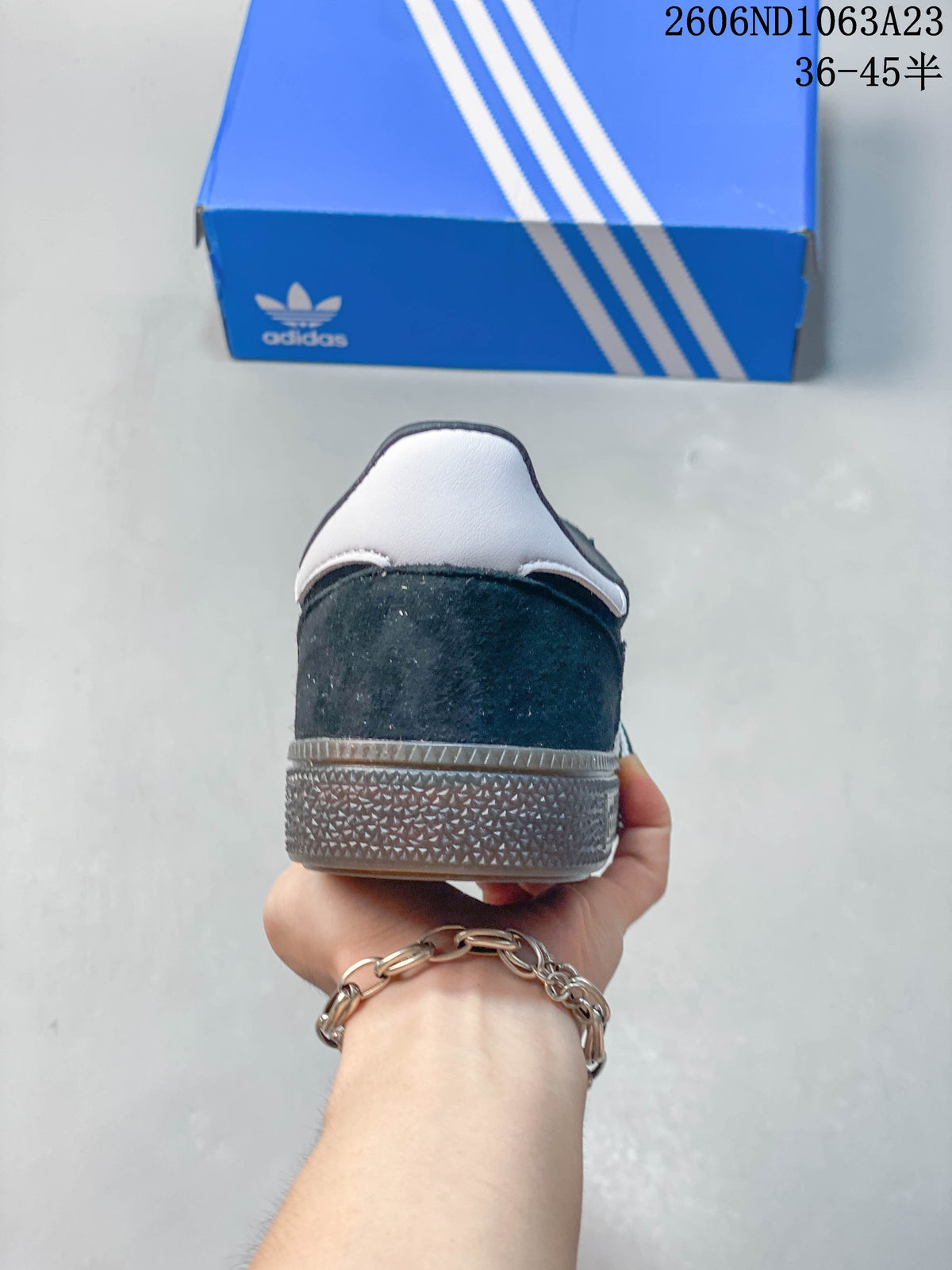 Rear view showing the white heel detail and textured sole