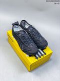 Pair of dark denim-style Onitsuka Tiger Mexico 66 SD low-top sneakers on a yellow shoe box