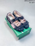 Black and pale pink low-profile sneakers with ruffles and lace trim