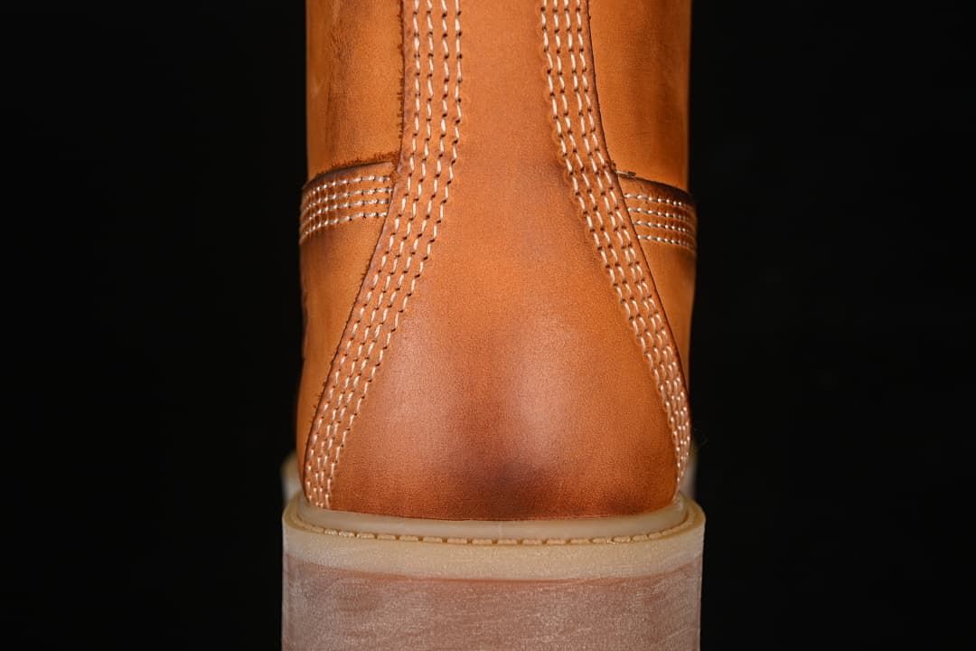 Rear view showing stitched heel panels and lugged outsole