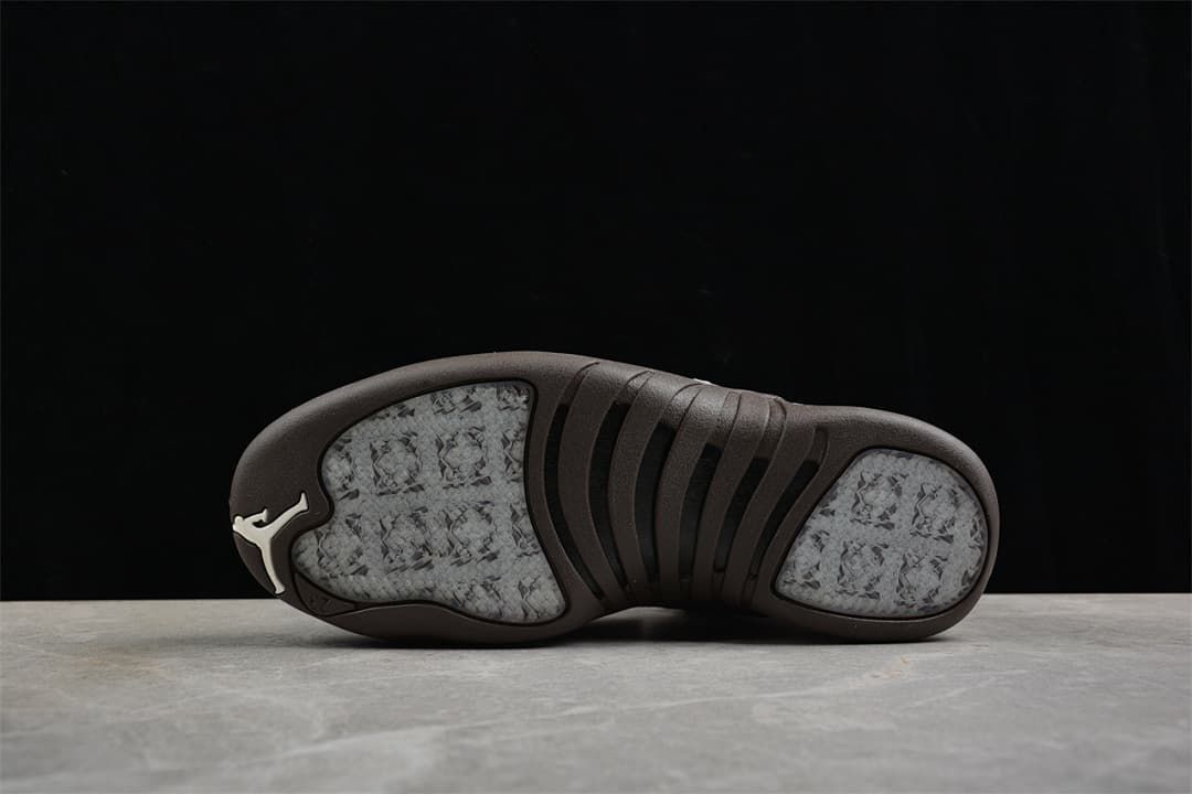 Outsole view of the Air Jordan 12 with dark brown sections and patterned inserts