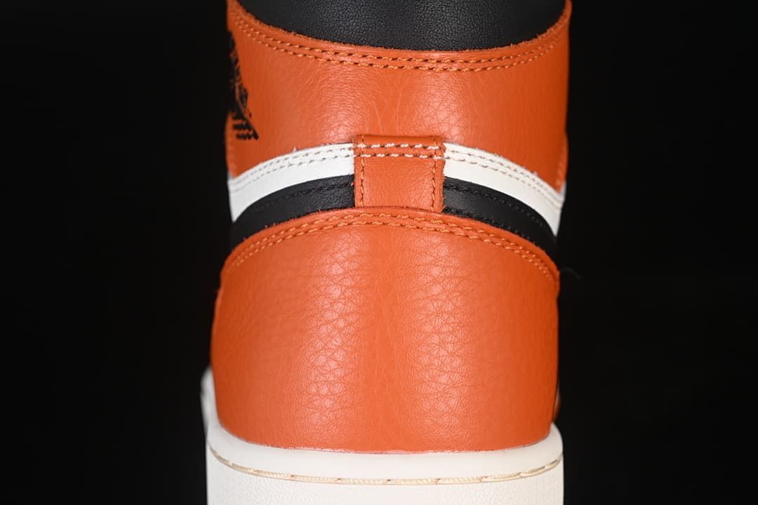 Close-up of the orange heel panel and layered rear details