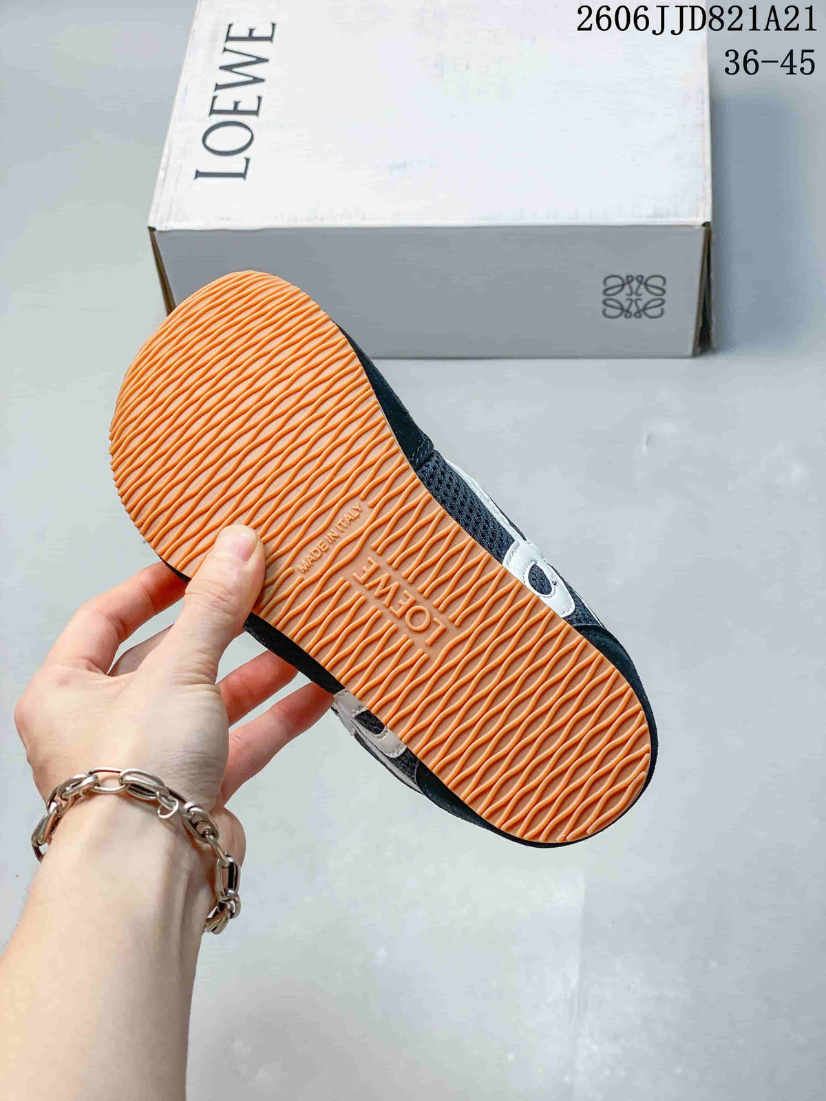 Close-up of the gum-colored textured outsole on a navy sneaker