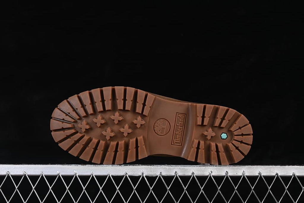 Underside view of the boot's lugged tread