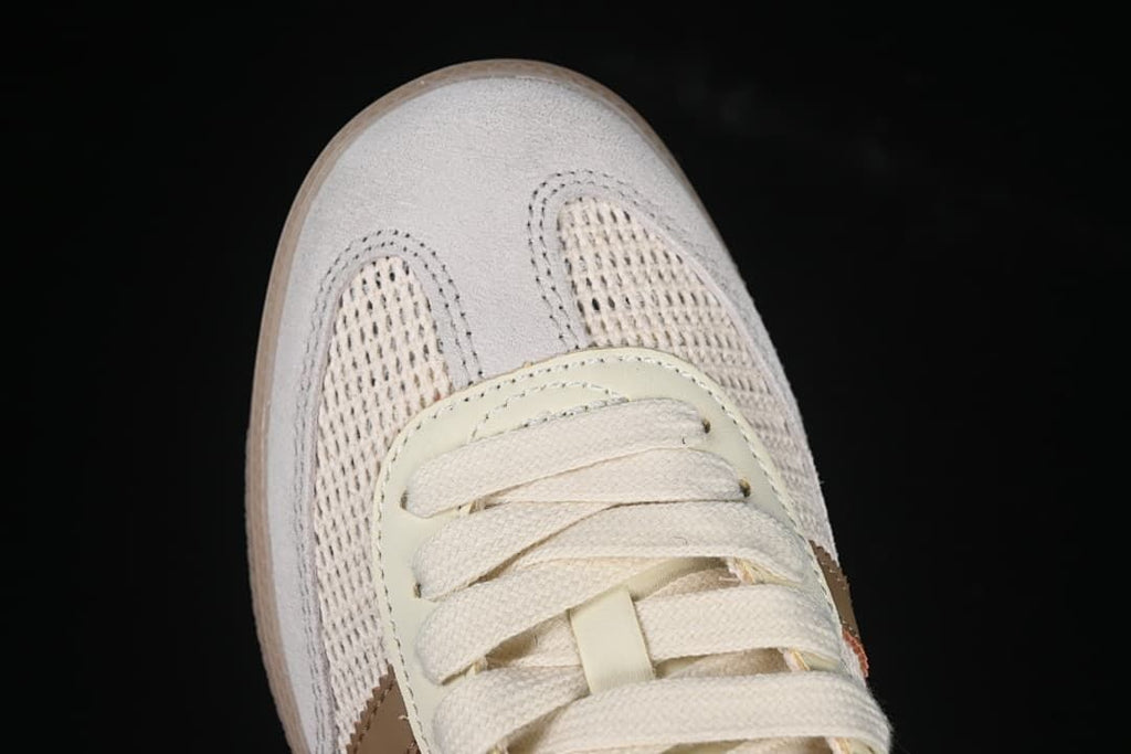 Top-down close-up of the toe, laces, and textured upper