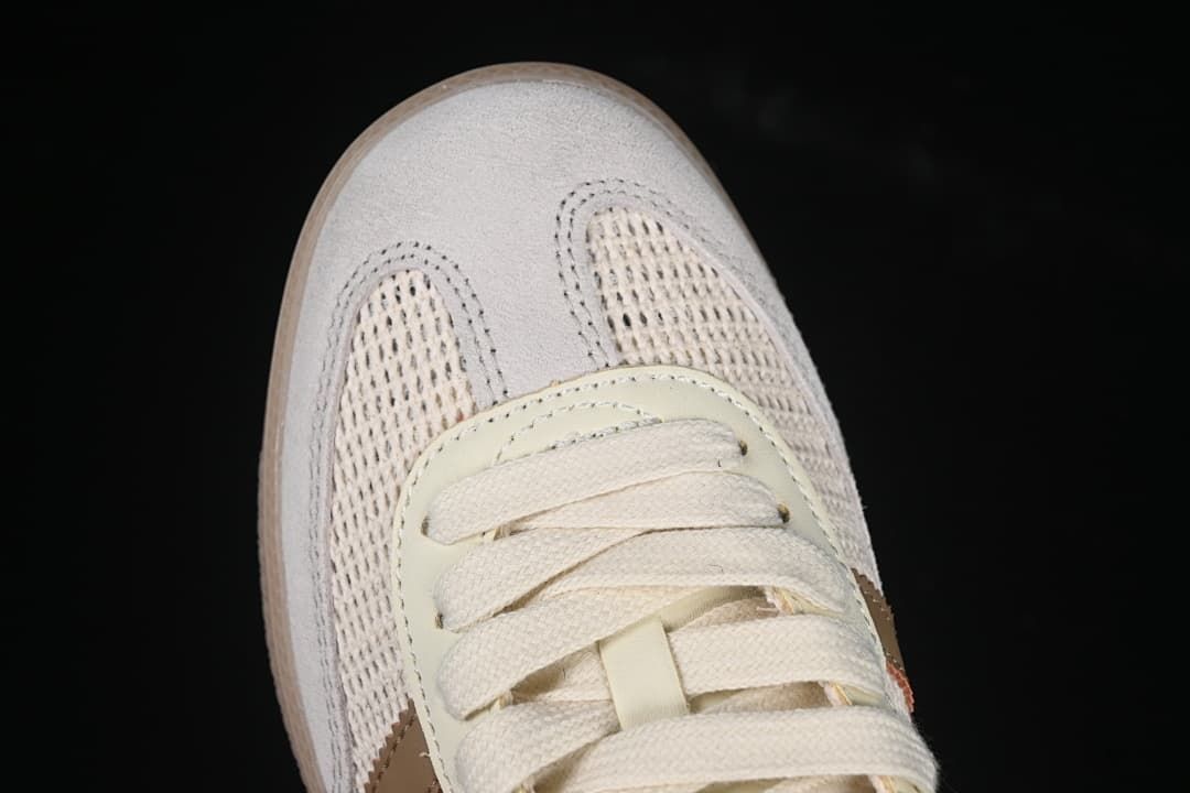 Top-down close-up of the toe, laces, and textured upper