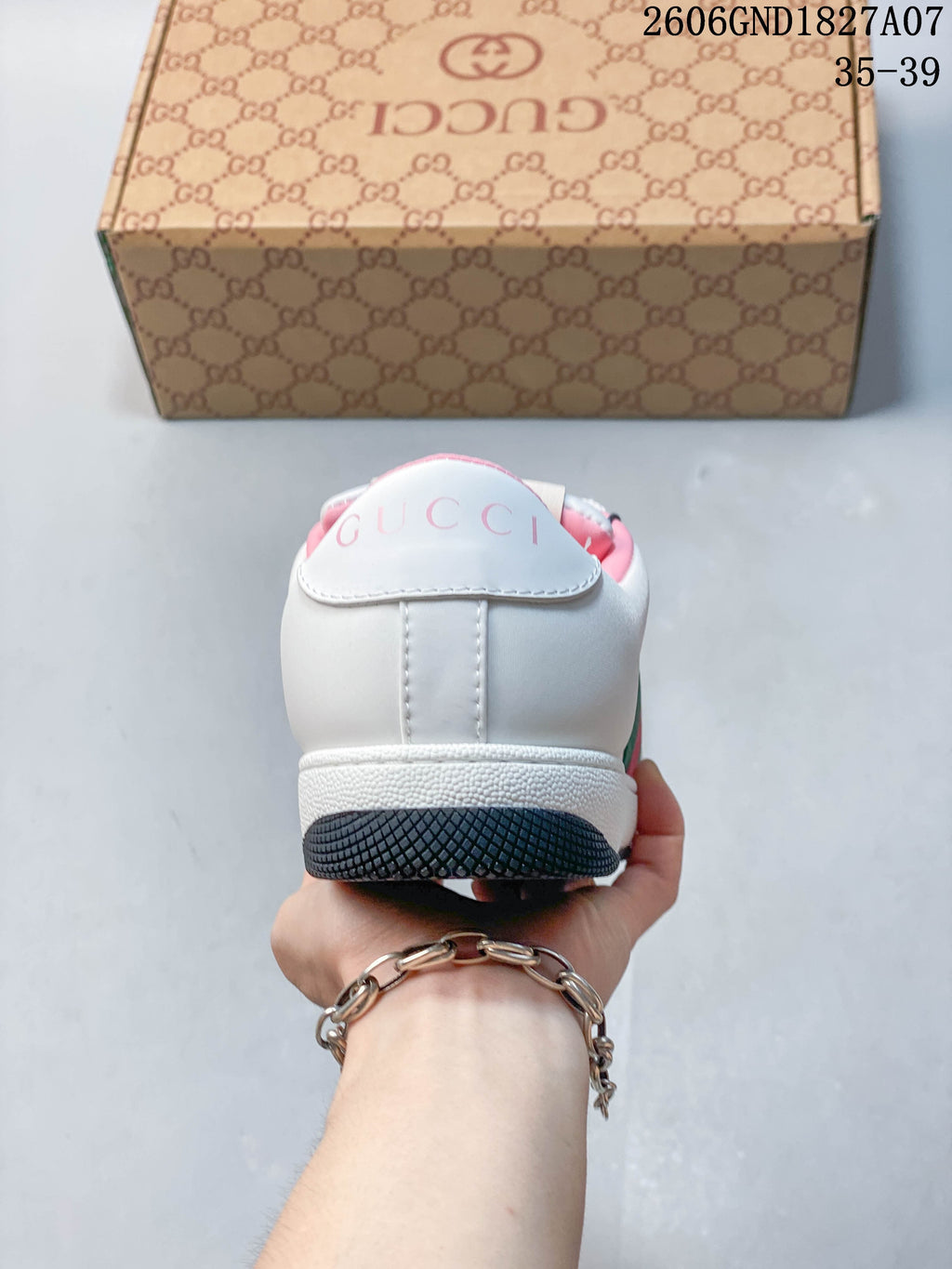 Rear view showing the heel branding and pink lining.