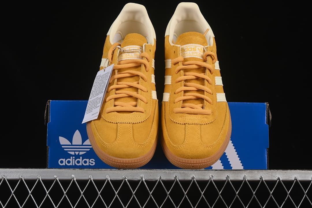Front view of the sneakers displayed on a blue adidas box