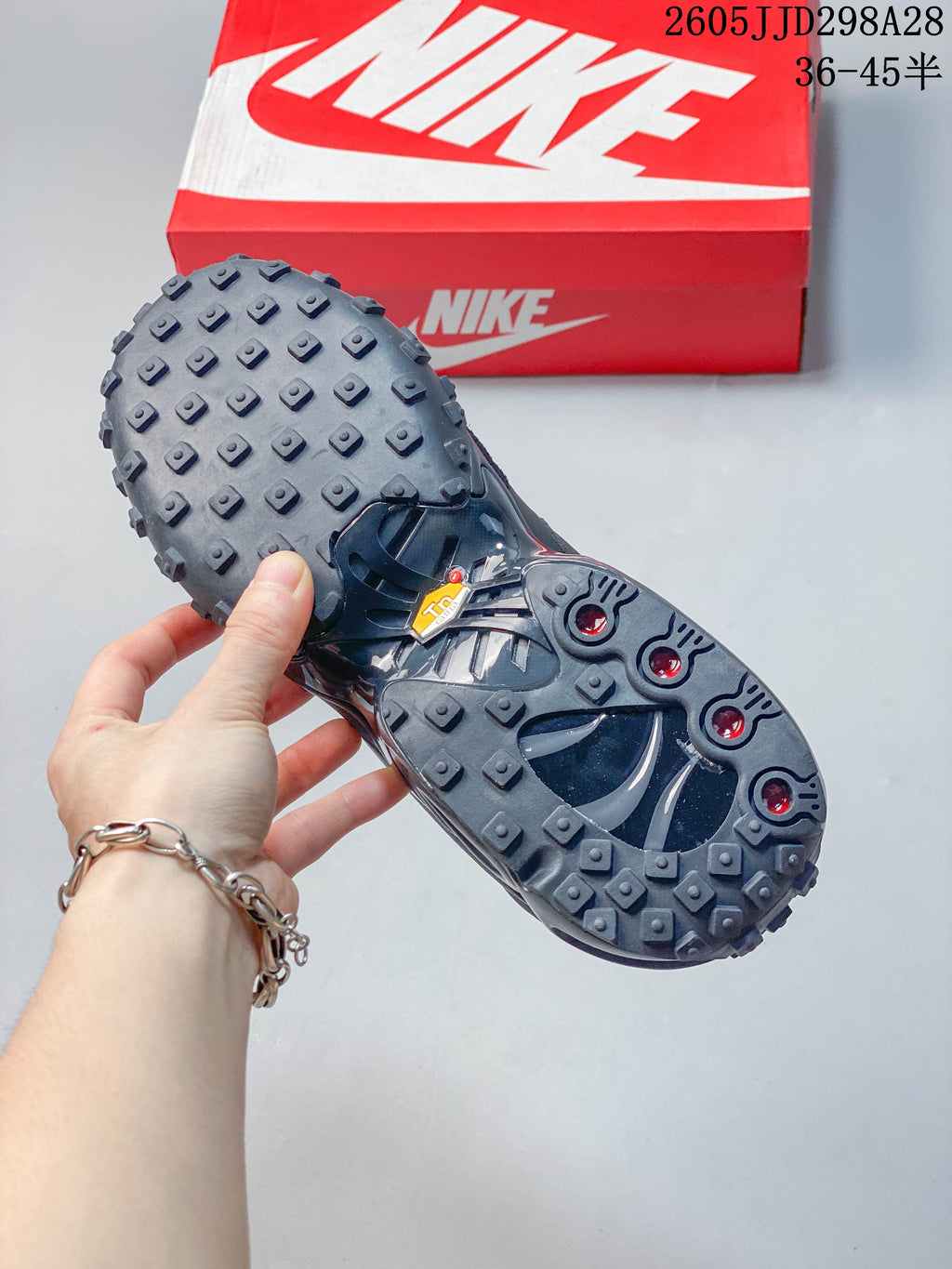 Close-up of the studded outsole and visible heel air unit