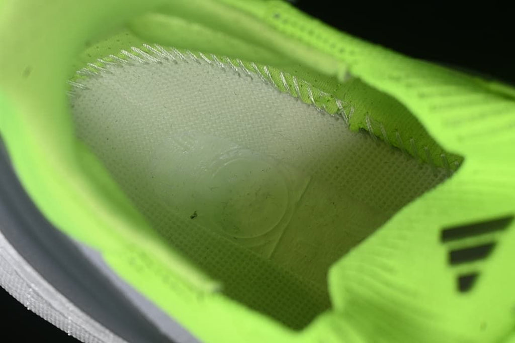 Close-up view inside the lime green shoe