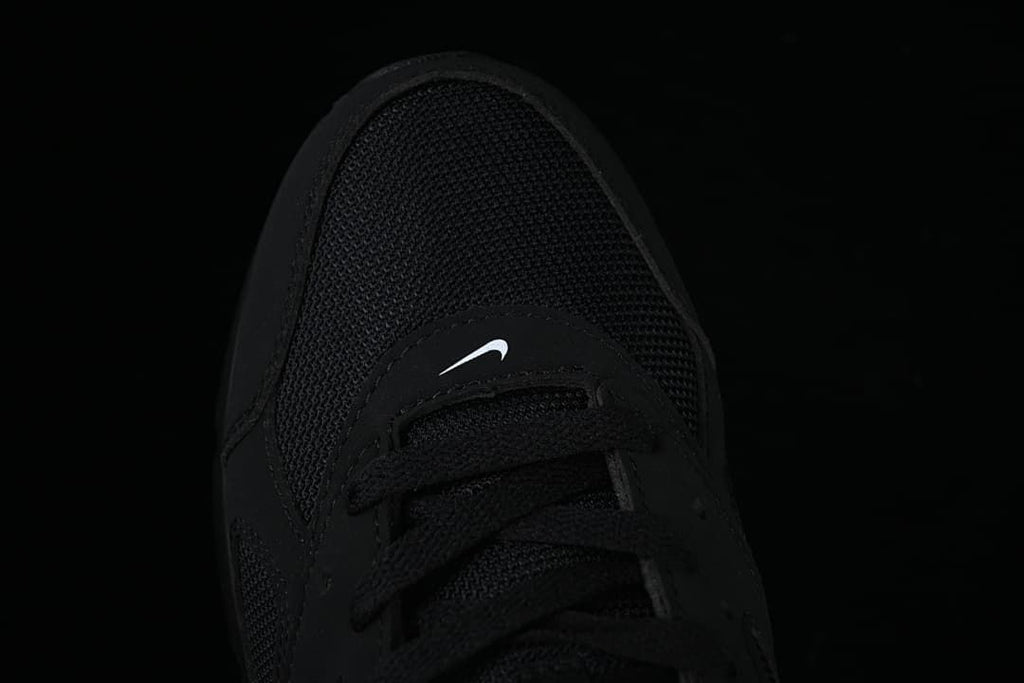 Top-down close-up of the mesh toe and lace area