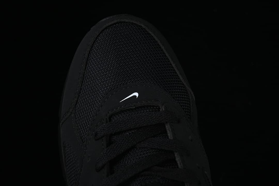 Top-down close-up of the mesh toe and lace area
