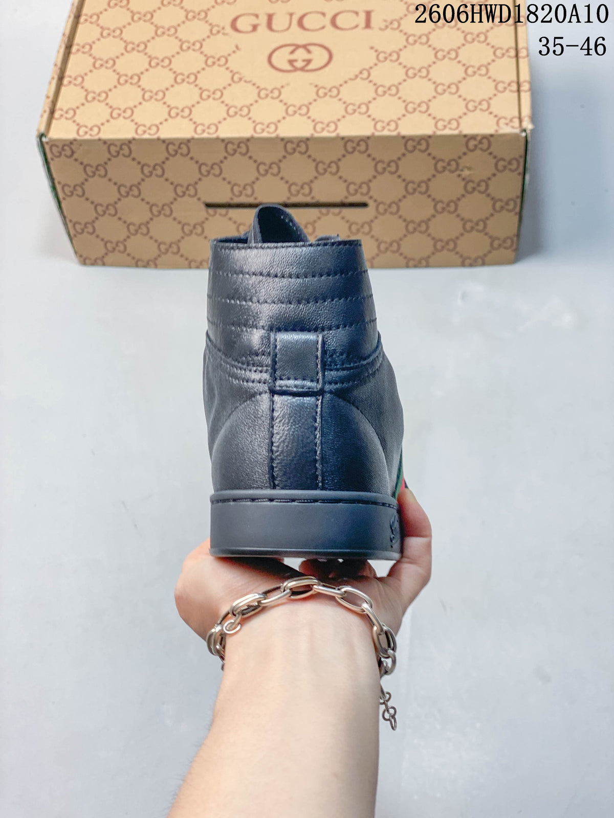 Rear view of a dark gray high-top sneaker showing the heel and padded collar.