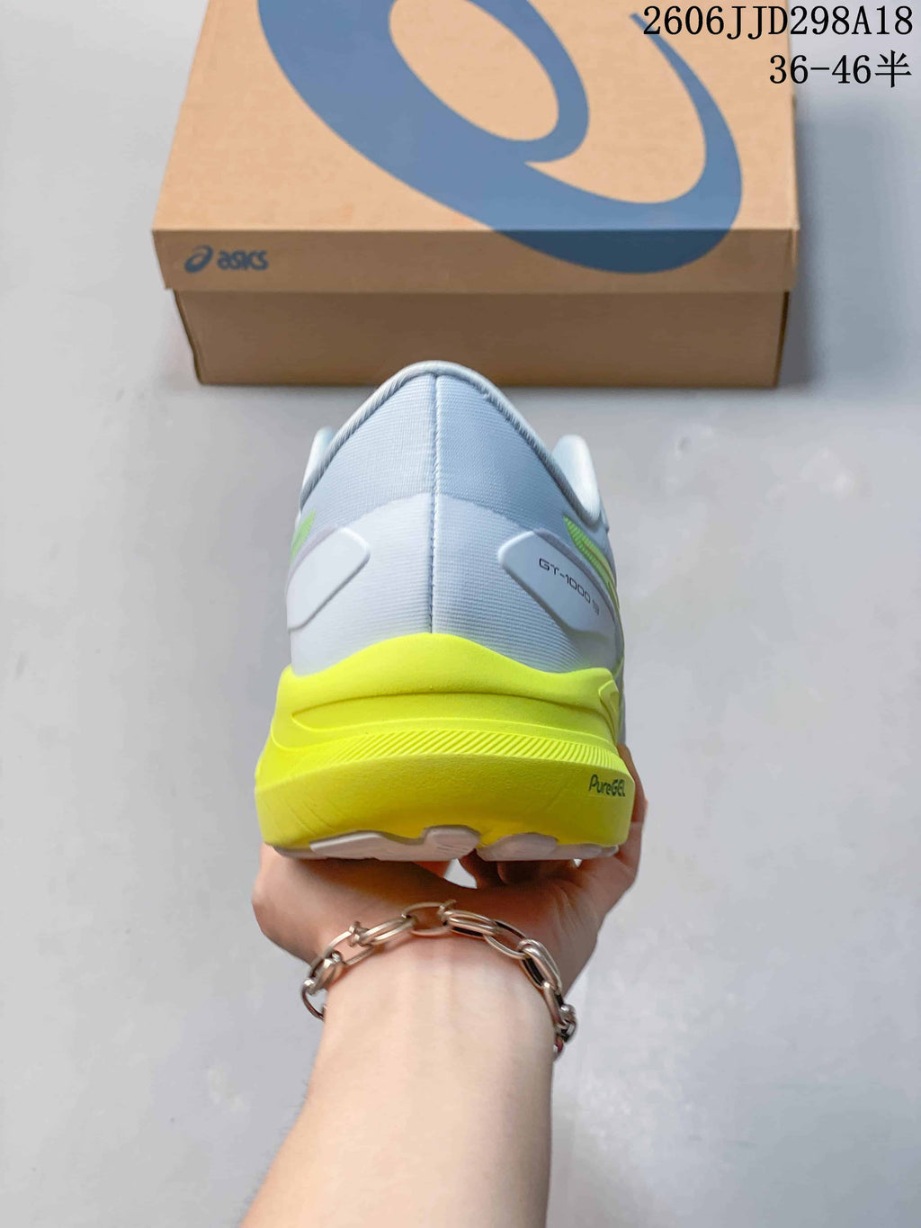 Rear view of the shoe showing its heel and bright lime midsole