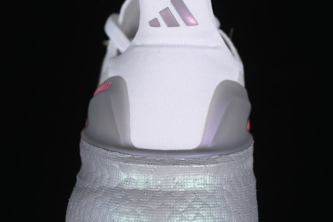 Rear view showing grey heel supports and reflective-looking silver heel detail