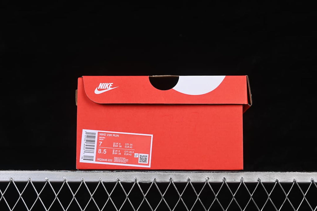 Red shoe box label identifying Nike V2K Run and model HQ3445-222