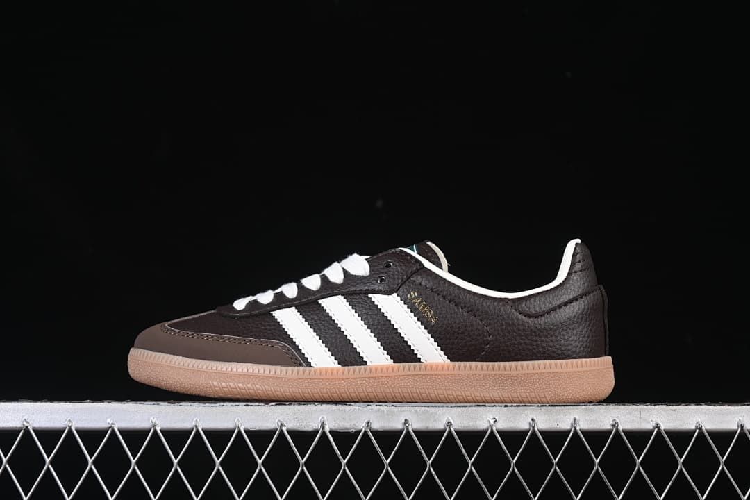 Side view of a dark brown adidas Samba OG sneaker with white stripes and a gum sole
