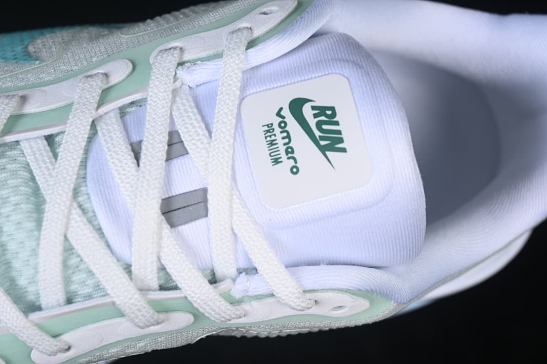 Close-up of the tongue, laces and pale mint lace supports