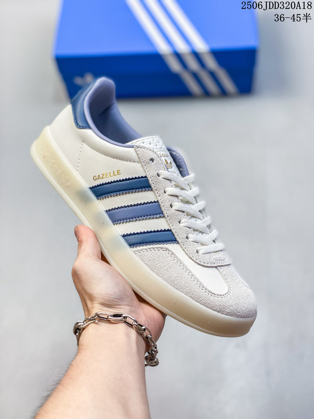 Close side view of the sneaker showing its cream upper, blue stripes, and blue heel tab.