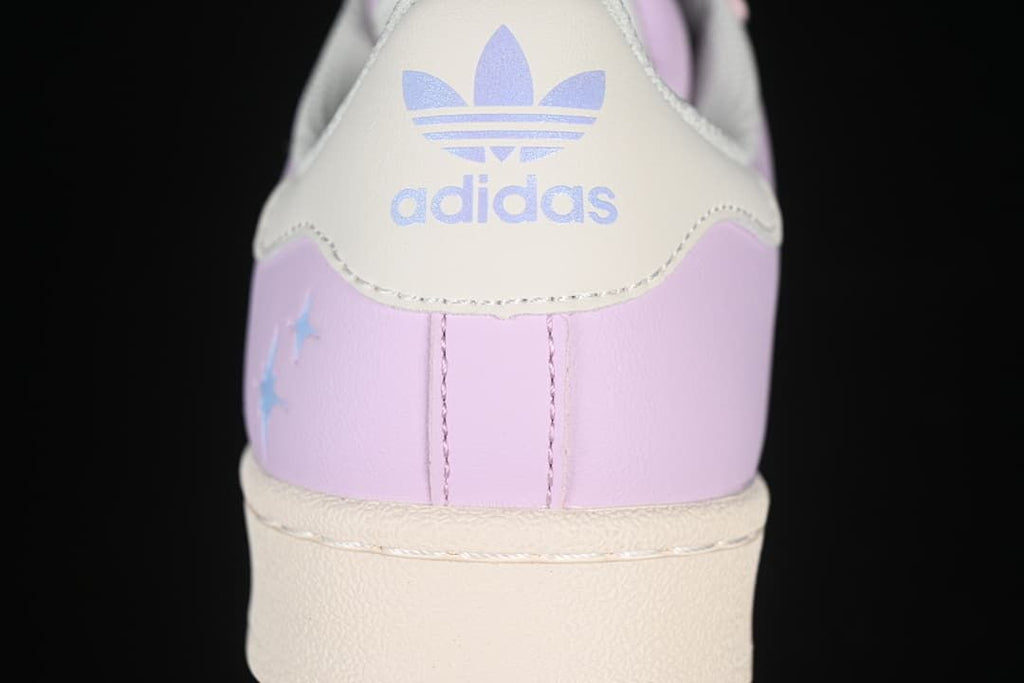 Rear view showing the off-white heel tab with adidas branding and star accents
