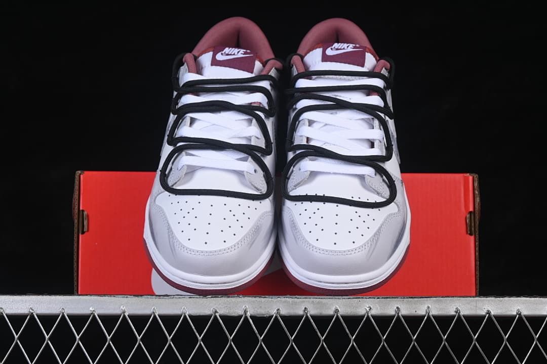 Front view of the pair showing perforated toe boxes and layered black cord-style straps