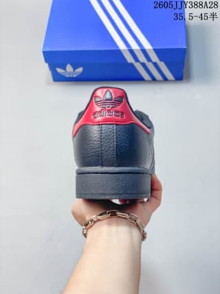 Rear view of the sneaker showing a red heel accent