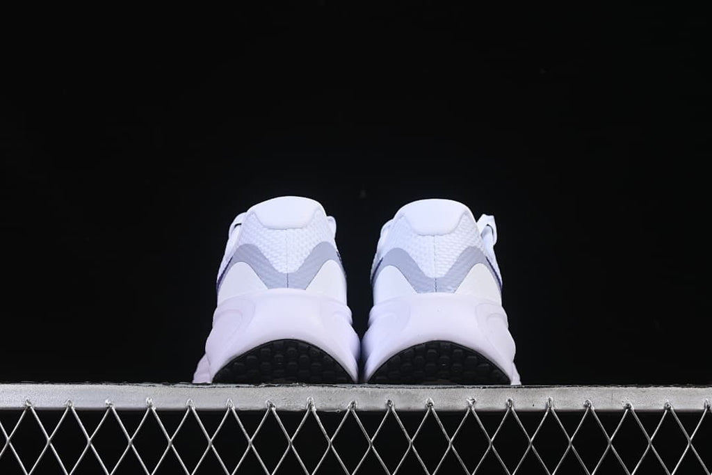 Rear view of both shoes and black outsole sections