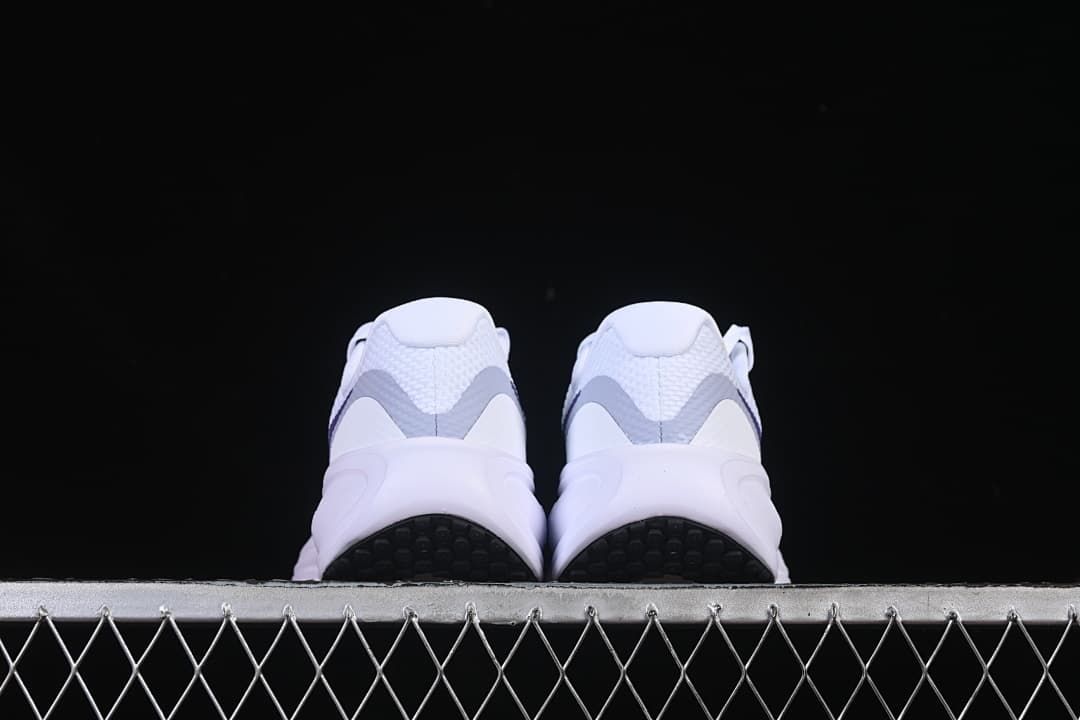 Rear view of both shoes and black outsole sections