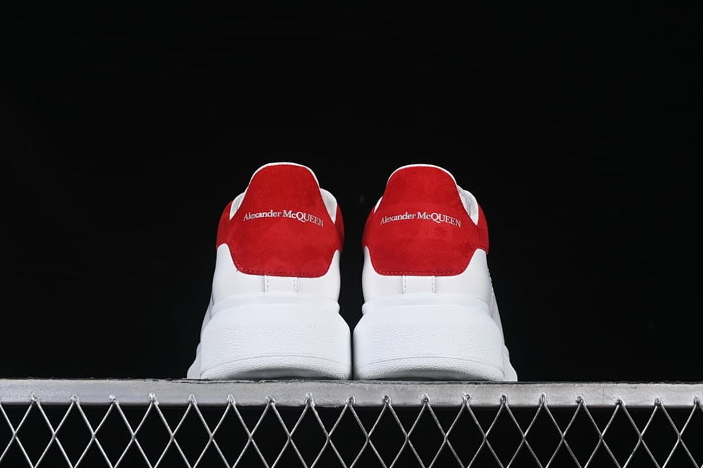Rear view of the pair showing matching red heel panels and thick soles.