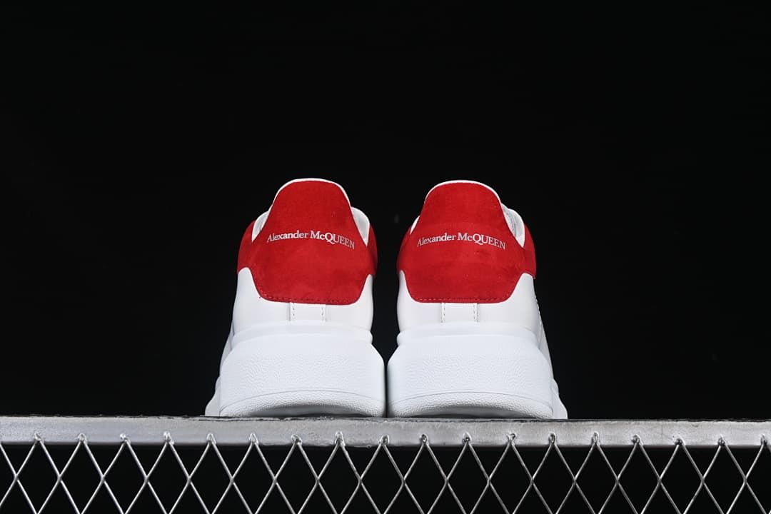Rear view of the pair showing matching red heel panels and thick soles.