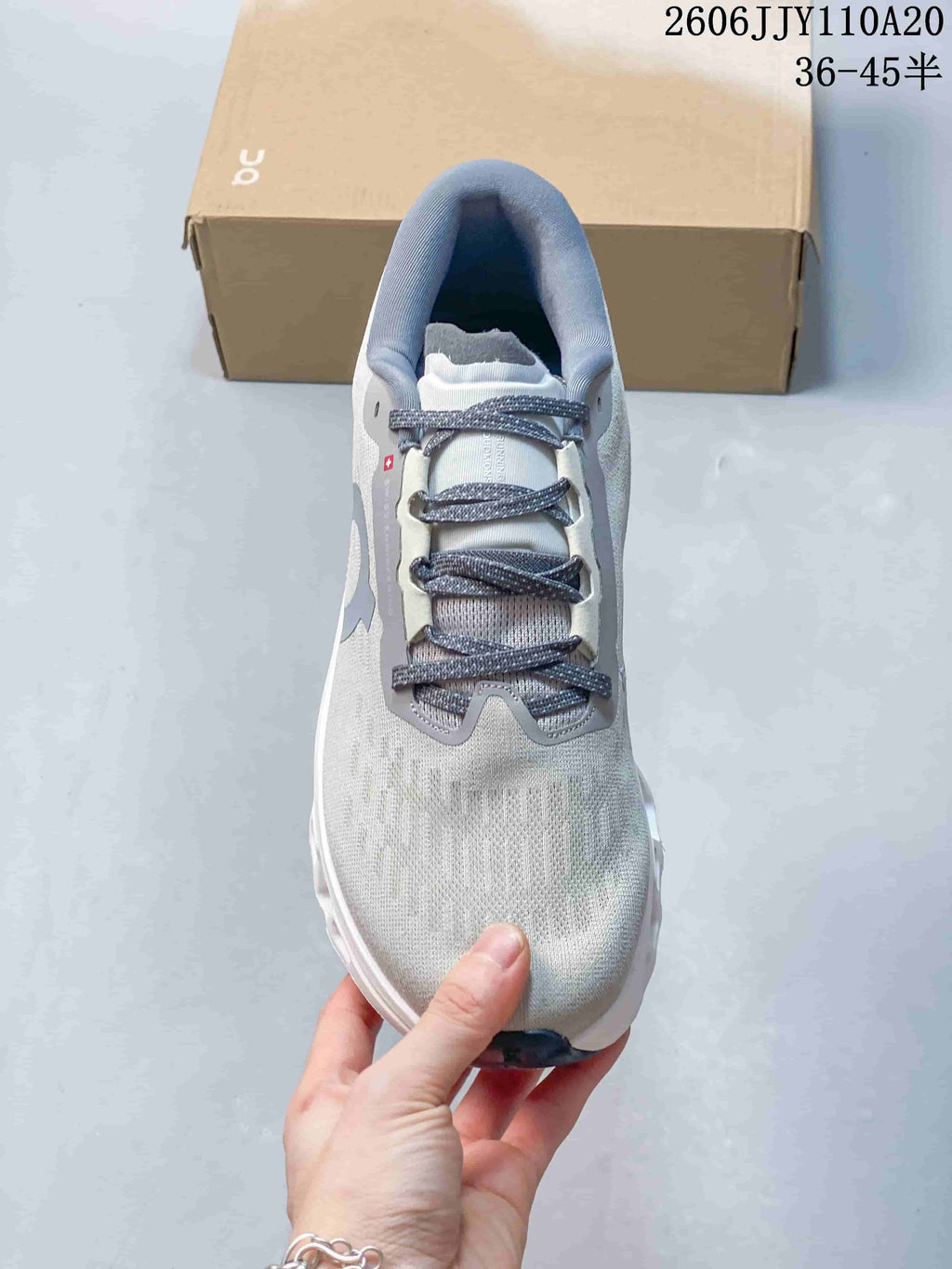 Top view of the shoe showing its laces, tongue, and gray-blue accents