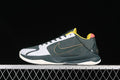 Side view of a dark green, white, yellow, and coral Nike Kobe 5 basketball shoe
