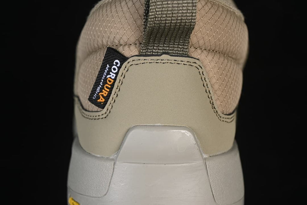 Rear close-up of the shoe with heel pull loop and label