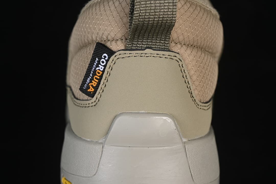 Rear close-up of the shoe with heel pull loop and label